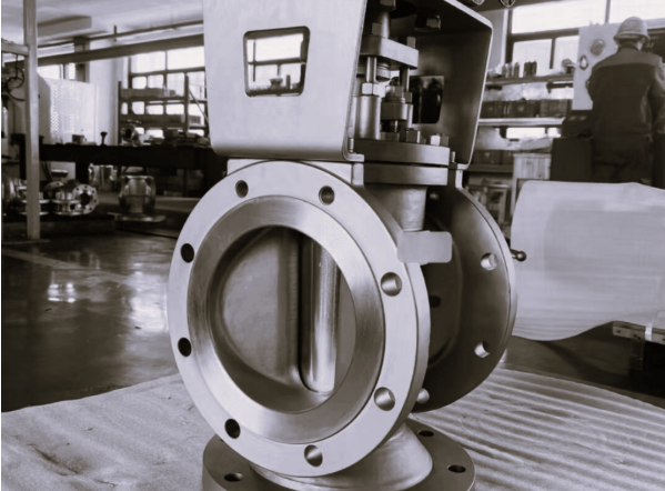 Flanged plug valve with manual handwheel operation in workshop